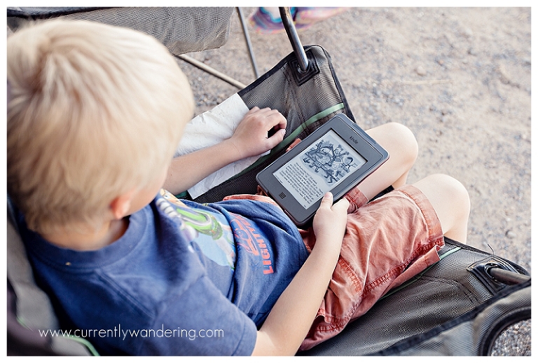 Young Boy Reading Kindle
